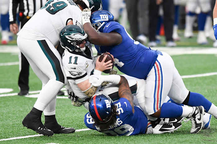 New York Giants defensive end Leonard Williams (99) and lineman Dalvin Tomlinson (94) sack Philadelphia Eagles quarterback Carson Wentz (11) in the second half. The Giants defeat the Eagles, 27-17, at MetLife Stadium on Sunday, Nov. 15, 2020.